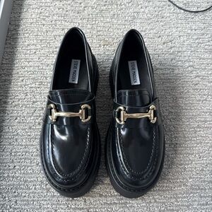 Steve Madden Glossy Black Loafers with Gold Detail